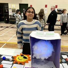 Student with solar system project